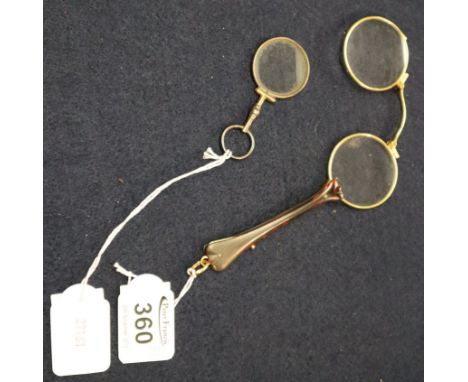 Pair of yellow metal and tortoiseshell folding lorgnette, together with a small, hand-held magnifying glass fob. (2)(B.P. 24%