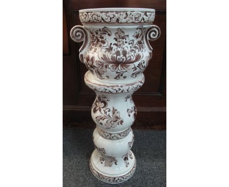 White and brown floral and foliate ceramic jardiniere on stand. (B.P. 24% incl. VAT) CONDITION REPORT: 70 cm tall approx.