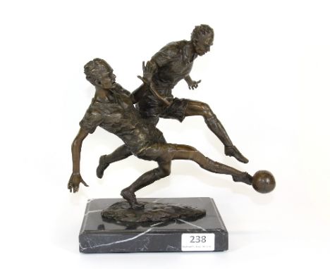A bronze figure of footballers on a black marble base (H:26cm)