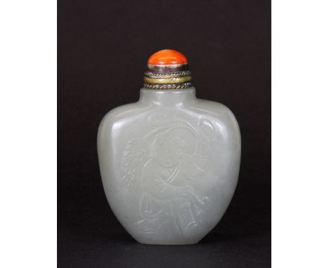 A carved Nephrite jade snuff bottle with gilt and coral stopper (6.5cm)