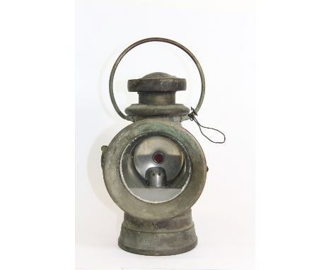 An early 20thC candle vehicle lamp