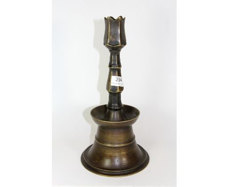 Islamic Interest, an 18th century bronze candlestick, H 34cm