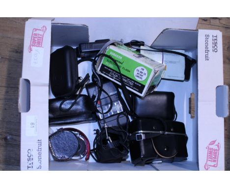 A box of vintage cameras and accessories 