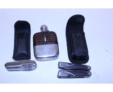 A vintage hip flask and selection of pocket knives 