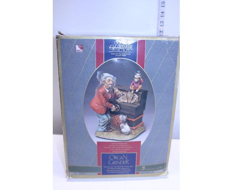 A boxed Melody in Motion 'Organ Grinder' 