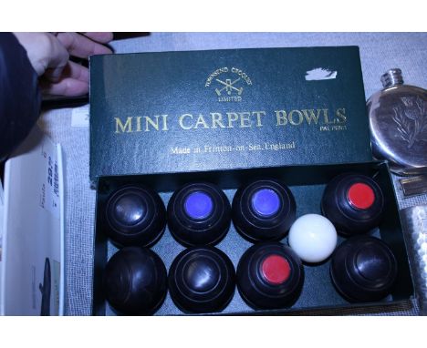 A box set of mini carpet bowls 