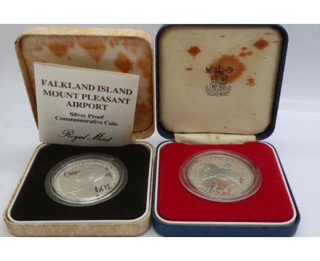 The Royal Mint: two silver proof crowns, Falkland Island Mount Pleasant Airport with certificate and Silver Jubilee. UK P&amp