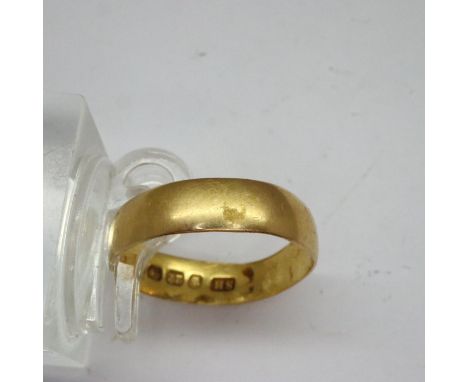 22ct gold band, size K, 2.1g, slightly misshapen. UK P&amp;P Group 1 (£16+VAT for the first lot and £2+VAT for subsequent lot