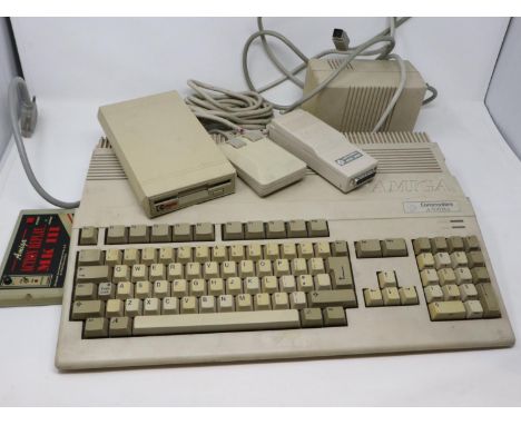 Commodore Amiga A500 Plus computer system, working and boots, with Amiga action replay MKIII, power supply, mouse, external d