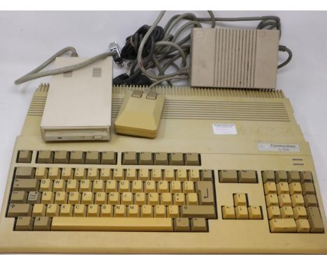 Commodore Amiga A500 computer system, working and boots, with power supply, mouse and external disk drive. All electrical ite
