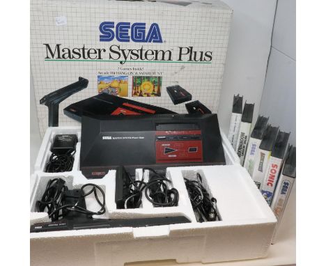 Sega Master System Plus gaming console, boxed and appears complete, with six games. All electrical items in this lot have bee