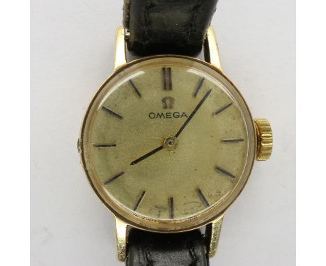 OMEGA: ladies 9ct gold wristwatch on a leather strap, working at lotting. UK P&amp;P Group 1 (£16+VAT for the first lot and £