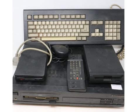 Commodore CDTV computer system, working and boots, with keyboard, mouse, remote and two external disk drives, CD drive does n
