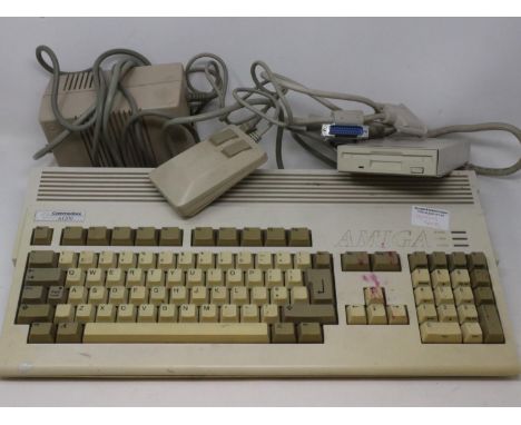 Commodore Amiga A1200 computer system, working and boots, with power supply, mouse and external disk drive. All electrical it
