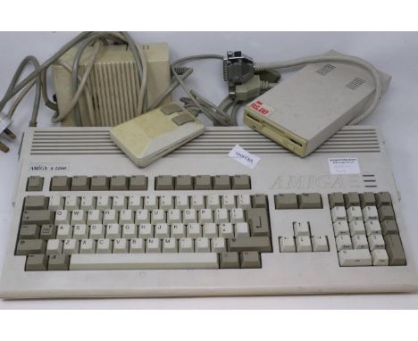 Commodore Amiga A1200 computer system, working and boots, with power supply, mouse and external disk drive. All electrical it
