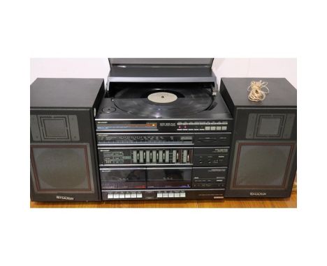 Sharp plays both sides linear tracking record player stereo system, model VZ 1600, including cassette, radio and speakers. Al