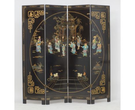 A Chinese four panel black lacquer screen. Each panel having two sides, one side inlaid in low relief with soapstone, mother 