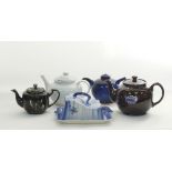 A collection of ceramic tea pots
