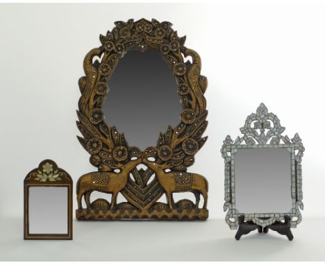 A Syrian mirror with a mother of pearl inlaid wooden frame H31cm on wooden stand, one smaller Syrian mirror H20cm in a boxwoo