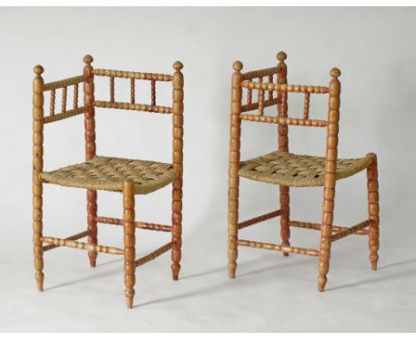A pair of Cypriot provincial corner chairs, brown painted turned bobbin beechwood with straw seats 45x45cm, H85cm. Mid 20th c