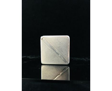 An Art Deco Eclipso folding watch, the exterior of two engine turned triangular sections with push button catch, opening to r