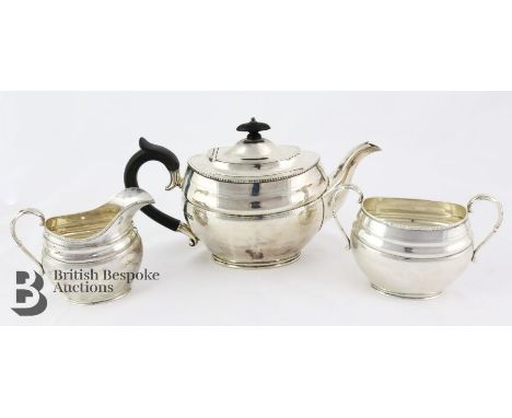 A silver tea trio marked&nbsp; C.C.P (Sibray, Hall &amp; Co) comprising tea pot London 1916 with wooden handle and finial, su