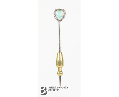 18ct yellow gold tie stick, set with a heart-shaped fire opal 6 mm and 11 pts of old-cut dias, approx 1.46 gms.&nbsp;