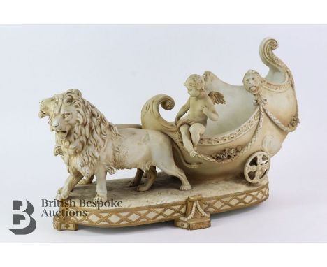 Bohemian ceramic group, 19th century, shell-form chariot drawn by two lions with a seated cherub, approx 44 cms x 27 h cms, f