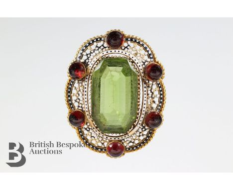 Victorian 9ct yellow gold enamel and green peridot brooch, measuring 25 x 15 x 7mm. The brooch measures 40 x 30mm, approx 13.