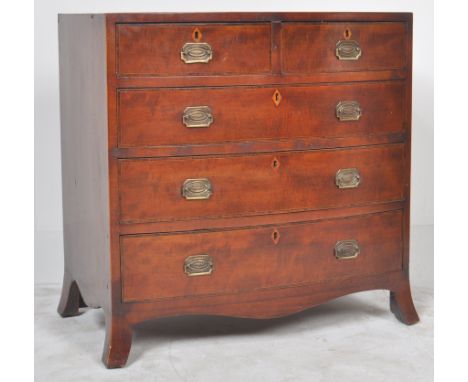 An early 19th Century George III mahogany bow fronted chest of drawers. The bow front bank of two over three drawers having b