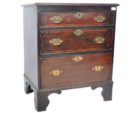 An 18th Century George II oak and walnut crossbanded bachelors chest of drawers of smaller proportions . The bank of three gr