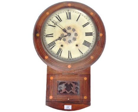 A late 19th Century American rosewood drop dial wall clock&nbsp;having a painted white dial with Roman numeral chapter ring a