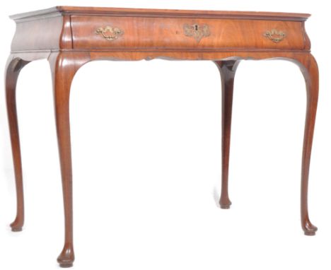 A 19th Century walnut &amp; mahogany silver table having a raised edge tray top with single drawer to the frieze having brass