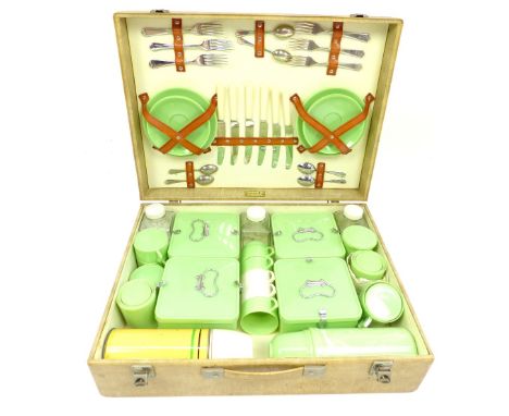 A 1950s fitted picnic  hamper, complete for six people to include knives, forks, teaspoons, storage containers, plates, sauce