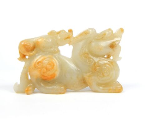 Chinese white jade dragon, with a temple lion upon his back, 5.8x 10cm