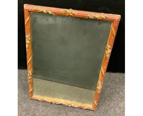 A late 19th/early 20th century Italian easel framed mirror, gilt and red floral ribbon carved frame, 59.5cm high, 49cm wide 