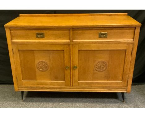 .A 20th century oak sideboard, half gallery, rectangular top above two short drawers and a pair of cupboard doors enclosing a