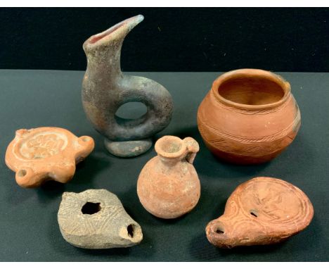 Antiquities - a Roman oil lamp cast with erotic scene, others;  a glass Unguentarium toilet vessel etc (6) 