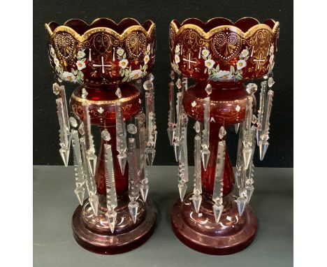 A pair of 19th century ruby and clear glass table lustres, painted with flowers and gilt heart motifs, 42.5cm high, 18.5cm di