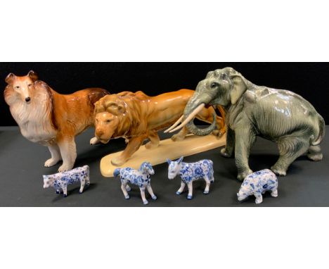 A Bretby model Elephant, standing trunk curled walking,26cm high, 39cm long;  West German Lion;  Melba Collie ;  delft blue a