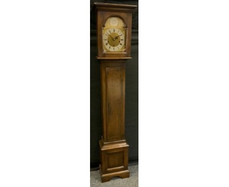 An early 20th century, reproduction, oak cased grandmother clock, musical chime movement, triple winding holes, brass face, r