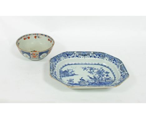 A late 18th Century Chinese blue and white meat dish, decorated birds in a garden, 37.5cm wide and an 18th Century Chinese bo