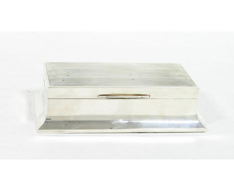 An Art Deco silver cigarette box, Walker & Hall, Sheffield 1940, the top with engine turned decoration, 20cm wide