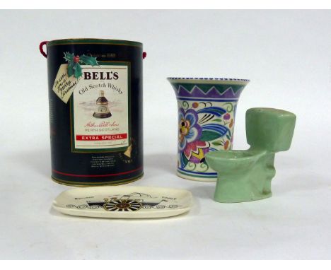 A Poole pottery vase of fluted form, decorated with stylised floral designs, 17cm high, a Poole pin tray, 1966, an Armitage w