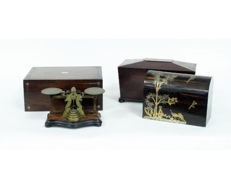 A mahogany tea caddy and a set of postal scales, a coromandel box and a mahogany box