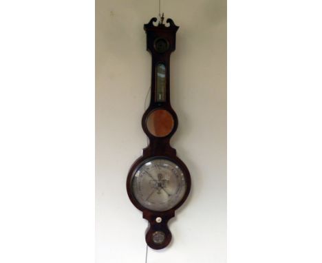 A Regency mahogany barometer and thermometer in a banjo shaped case, the level signed J Bradshaw, Whitchurch
