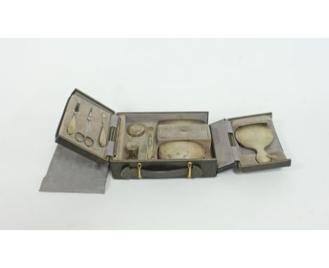 A lady's silver mounted dressing set in a fitted leather case, P G Dodd & Son, London 1927, with engine turned decoration com