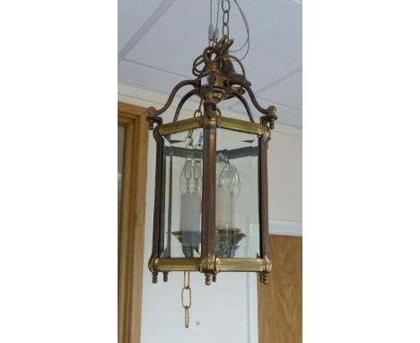 A brass hanging lantern of Regency design, fitted three lights, 51cm high