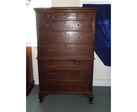 A George III mahogany chest on chest, circa 1780, with moulded cornice above three short and three long drawers on a chest of