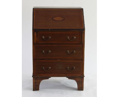 An Edwardian mahogany bureau with drawer under on bracket feet, 61cm wide